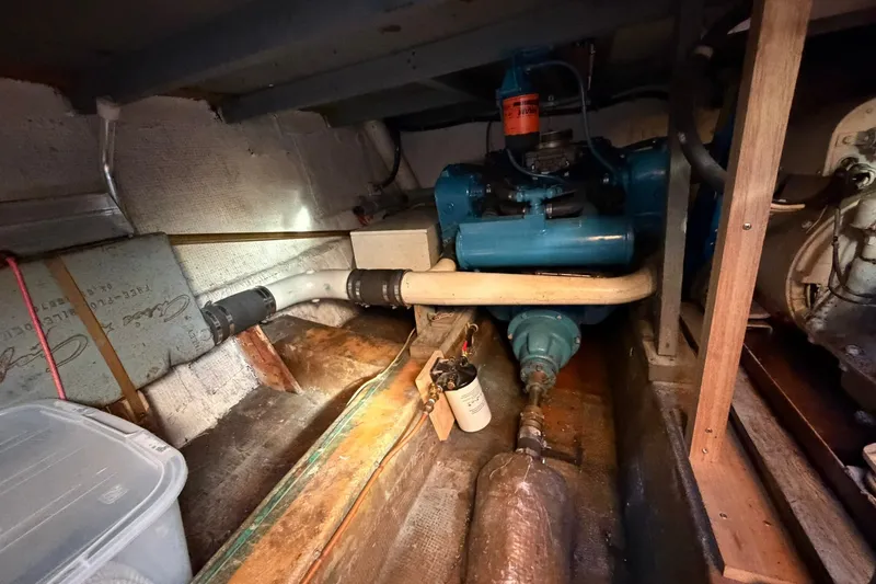 Slide: The Image of Engine room of a 1973 Chris-Craft 31 Sedan Cruiser, showcasing mechanical components. - 21
