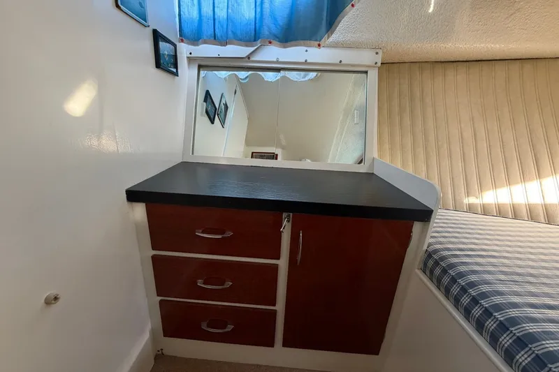 Slide: The Image of Interior of 1973 Chris-Craft 31 Sedan Cruiser with drawers and mirror. - 53