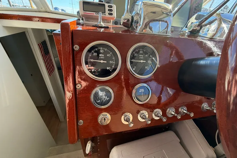 Slide: The Image of Dashboard of a 1973 Chris-Craft 31 Sedan Cruiser with gauges and controls. - 36