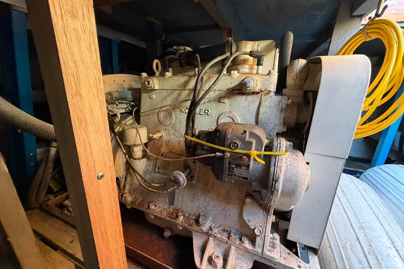 Slide: The Image of Engine of a 1973 Chris-Craft 31 Sedan Cruiser, showcasing mechanical components and wiring. - 23