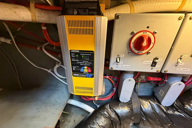 Slide: The Image of Electrical system of a 1973 Chris-Craft 31 Sedan Cruiser with battery charger and switches. - 66