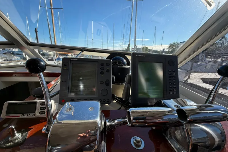 Slide: The Image of Helm of 1973 Chris-Craft 31 Sedan Cruiser with navigation equipment and controls. - 42