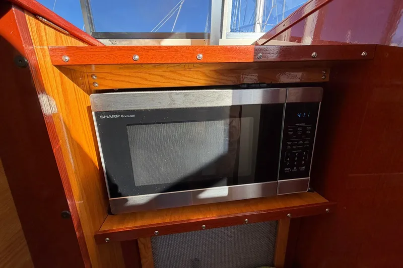 Slide: The Image of Sharp Carousel microwave in 1973 Chris-Craft 31 Sedan Cruiser interior. - 44