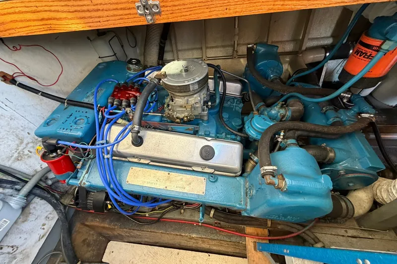 Slide: The Image of Engine of a 1973 Chris-Craft 31 Sedan Cruiser, showcasing detailed components and wiring. - 26