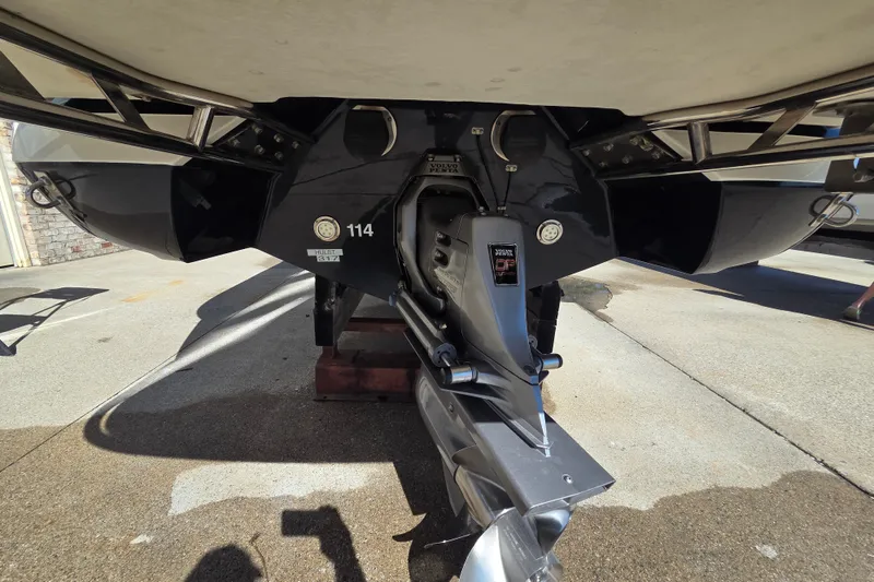 Slide: The Image of Rear view of a 2005 Cobalt 272 boat with visible propeller and drive system. - 19
