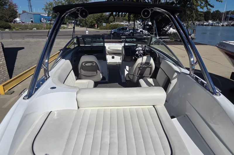 Slide: The Image of 2005 Cobalt 272 boat interior with white seating and sleek design. - 15