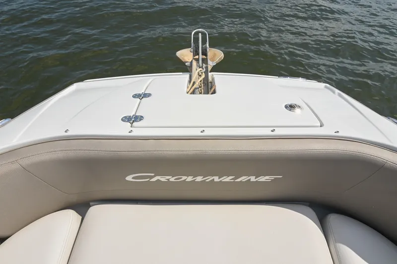 Slide: The Image of 2020 Crownline Eclipse E305 XS boat stern with logo, anchored on water. - 49