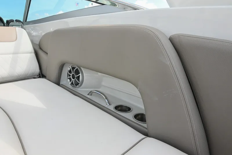 Slide: The Image of 2020 Crownline Eclipse E305 XS boat interior with speaker and cup holders. - 31