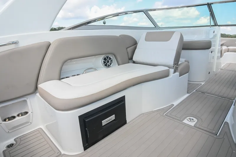 Slide: The Image of 2020 Crownline Eclipse E305 XS boat interior with beige seating and modern design. - 26