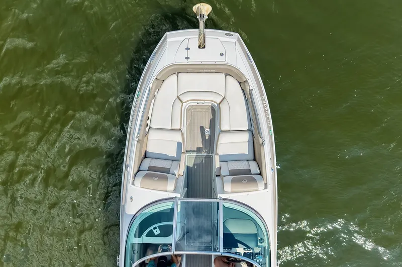 Slide: The Image of 2020 Crownline Eclipse E305 XS boat, aerial view, on green water. - 16