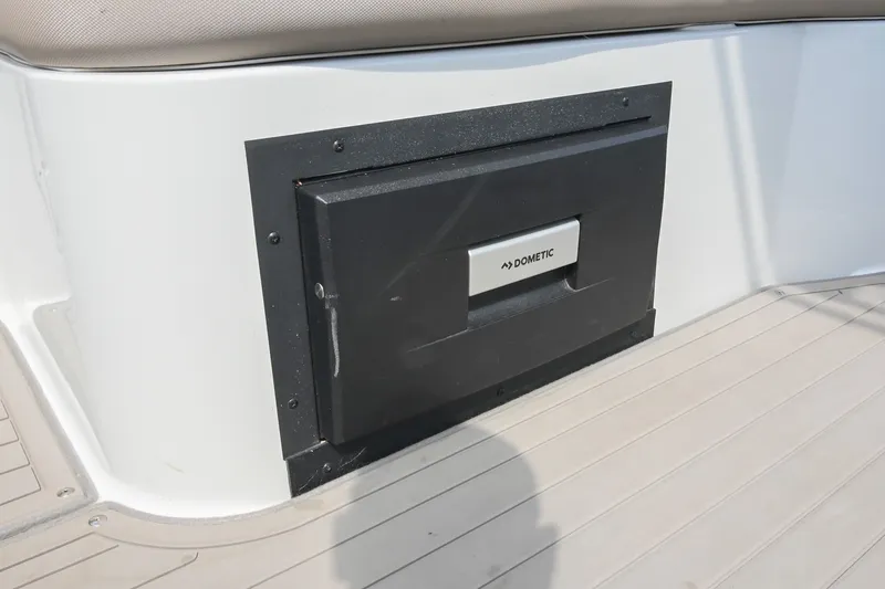 Slide: The Image of 2020 Crownline Eclipse E305 XS boat with Dometic cooler compartment. - 28