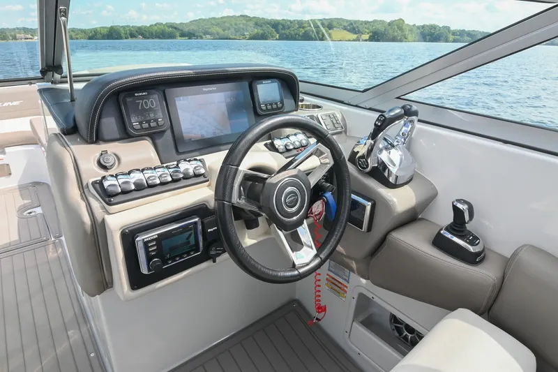 Slide: The Image of 2020 Crownline Eclipse E305 XS boat dashboard with advanced controls and navigation system. - 38