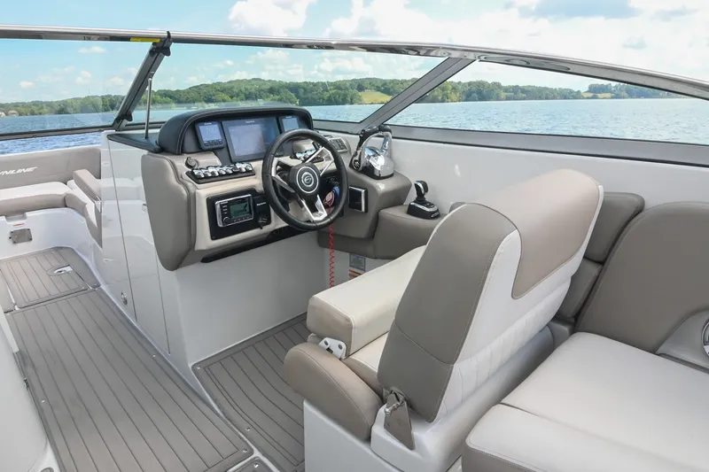 Slide: The Image of 2020 Crownline Eclipse E305 XS boat interior with modern dashboard and comfortable seating. - 36