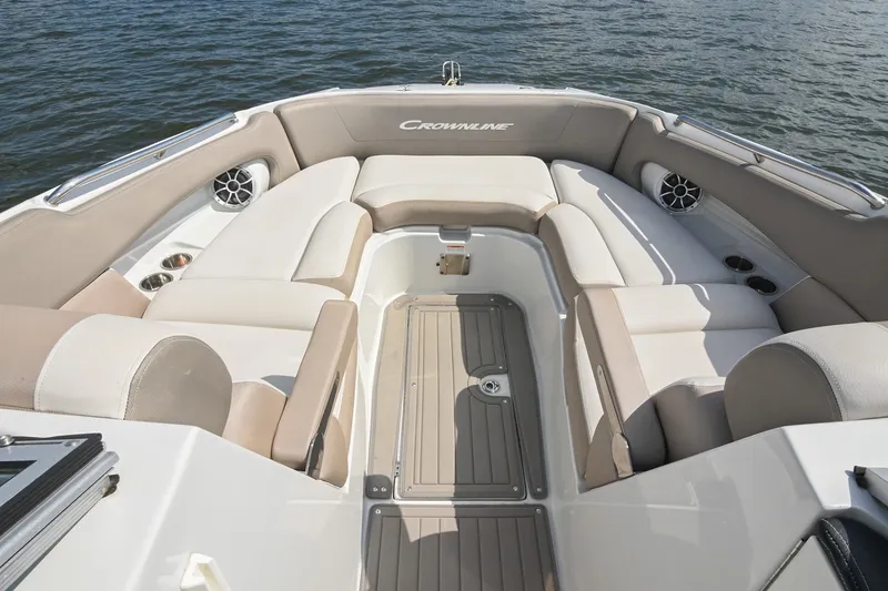Slide: The Image of 2020 Crownline Eclipse E305 XS boat interior with spacious seating and elegant design on the water. - 43