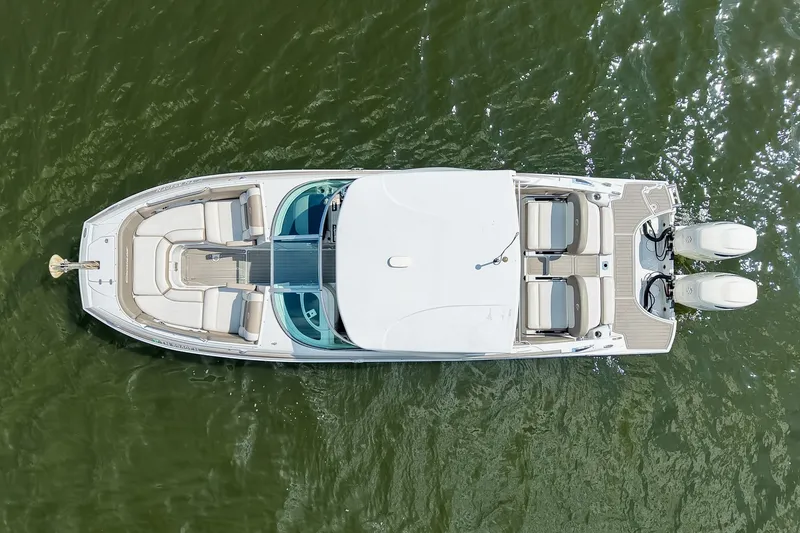 Slide: The Image of Aerial view of 2020 Crownline Eclipse E305 XS boat on water. - 15
