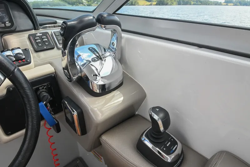 Slide: The Image of Control panel of 2020 Crownline Eclipse E305 XS boat with throttle and joystick. - 41