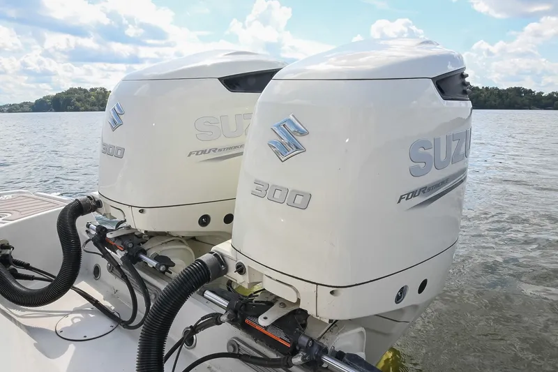 Slide: The Image of Twin Suzuki 300 outboard engines on a 2020 Crownline Eclipse E305 XS boat. - 19