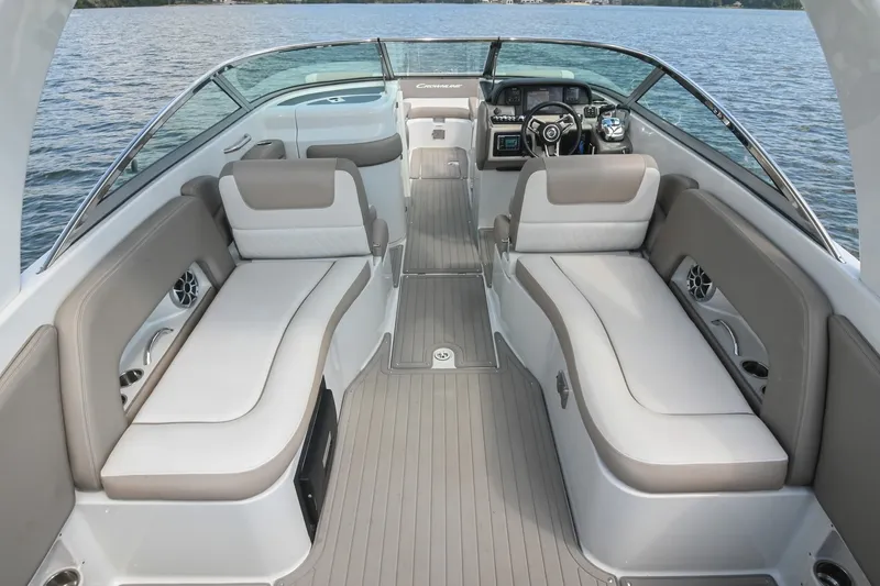 Slide: The Image of 2020 Crownline Eclipse E305 XS boat interior with spacious seating and modern dashboard. - 25
