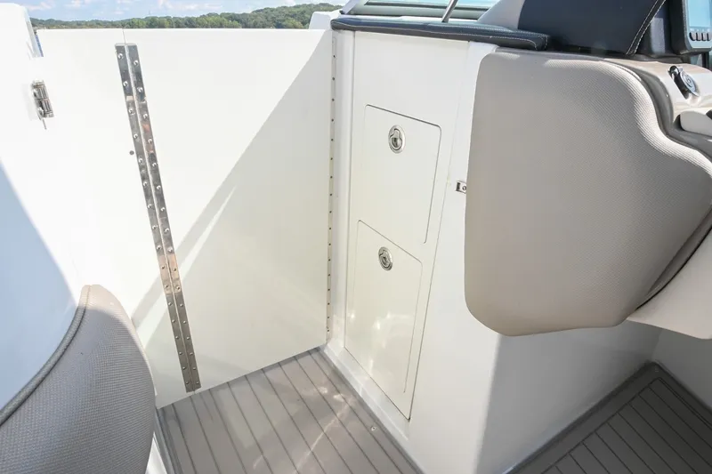 Slide: The Image of 2020 Crownline Eclipse E305 XS boat interior with storage compartments. - 42