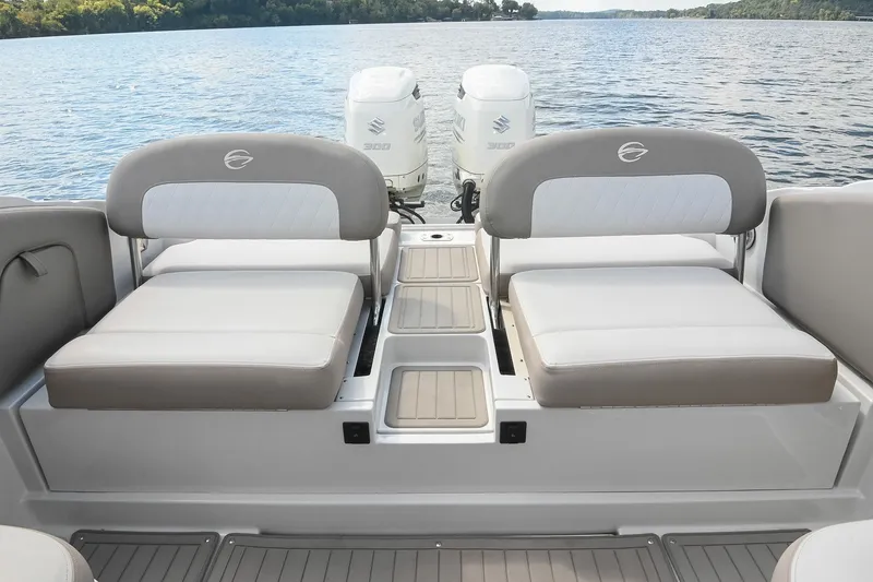 Slide: The Image of 2020 Crownline Eclipse E305 XS boat interior with dual seating and twin outboard motors. - 20