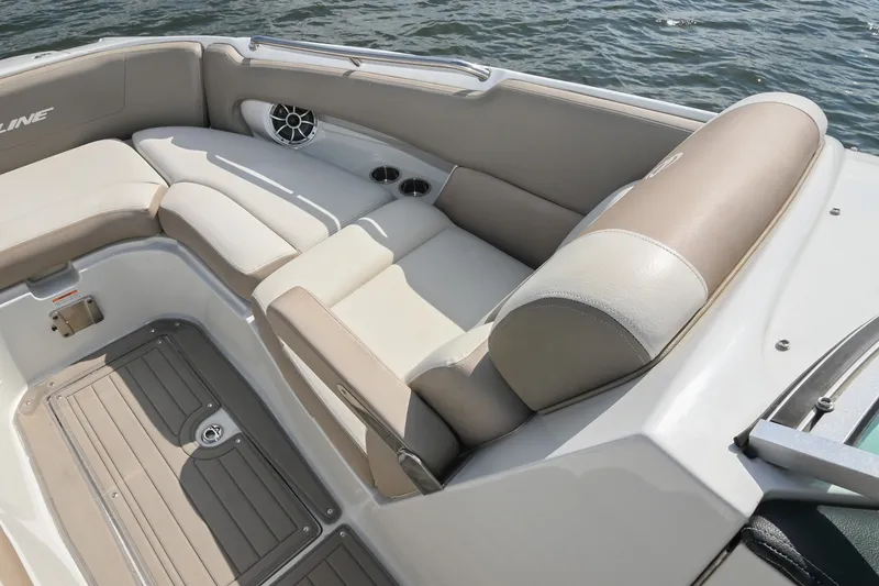 Slide: The Image of 2020 Crownline Eclipse E305 XS boat interior with beige seating and cup holders. - 45