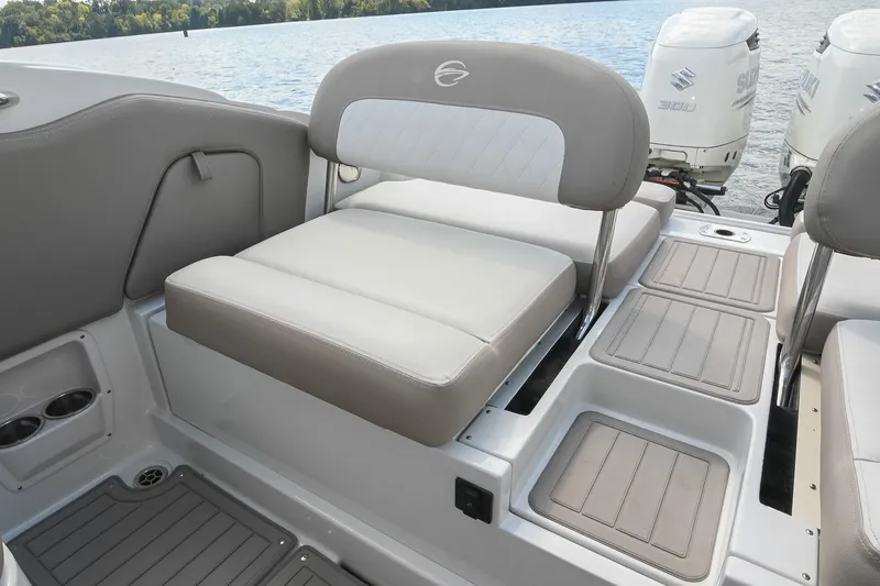 Slide: The Image of 2020 Crownline Eclipse E305 XS boat interior with seating and dual Suzuki outboard motors. - 21
