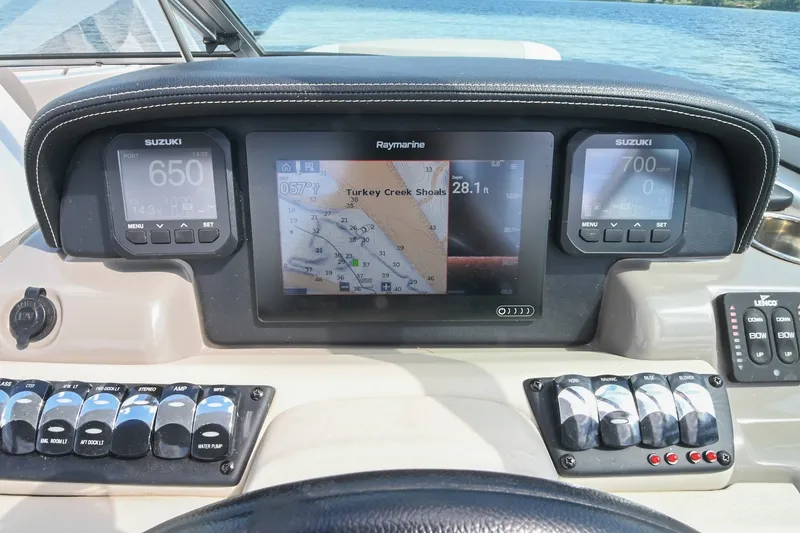 Slide: The Image of Dashboard of 2020 Crownline Eclipse E305 XS boat with navigation and control panels. - 40