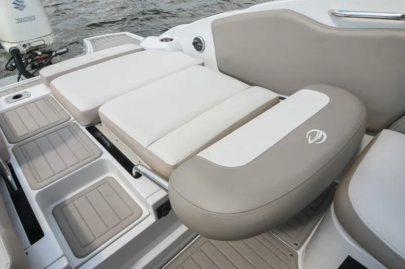 Slide: The Image of 2020 Crownline Eclipse E305 XS boat with cushioned seating and Suzuki 300 engine. - 23