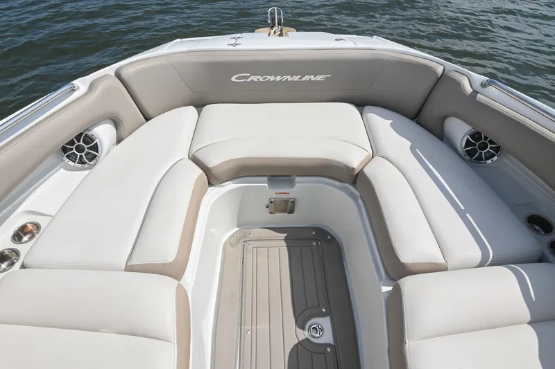 Slide: The Image of Luxurious seating area on 2020 Crownline Eclipse E305 XS boat, featuring plush cushions and speakers. - 46