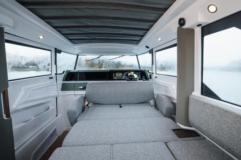 Slide: The Image of Interior of 2027 Axopar 38 XC Cross Cabin, featuring modern design and comfortable seating. - 13