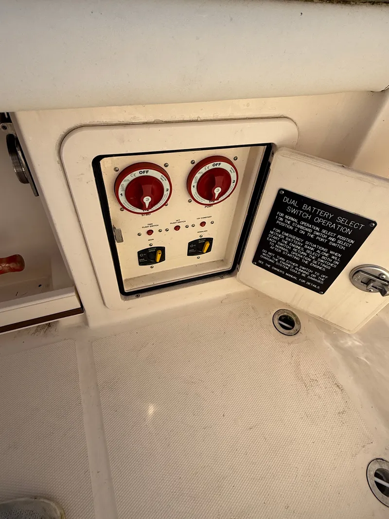 Slide: The Image of Battery switches and control panel on a Grady-White Freedom 307 boat. - 35
