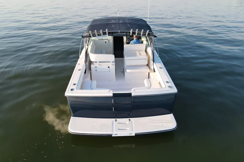 Slide: The Image of 2003 Tiara Yachts 2900 Coronet cruising on calm waters, rear view. - 12