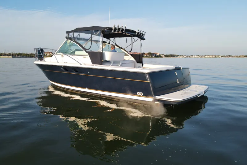 Slide: The Image of 2003 Tiara Yachts 2900 Coronet cruising on calm waters under clear skies. - 9