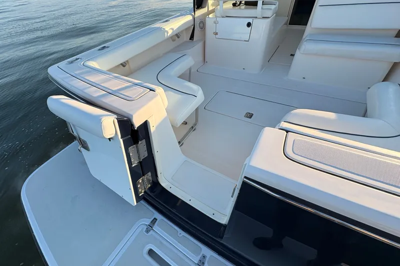Slide: The Image of 2003 Tiara Yachts 2900 Coronet boat interior with white seating and open deck. - 30