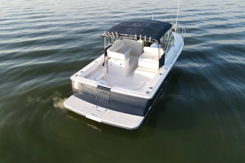 Slide: The Image of 2003 Tiara Yachts 2900 Coronet cruising on calm waters, rear view. - 5