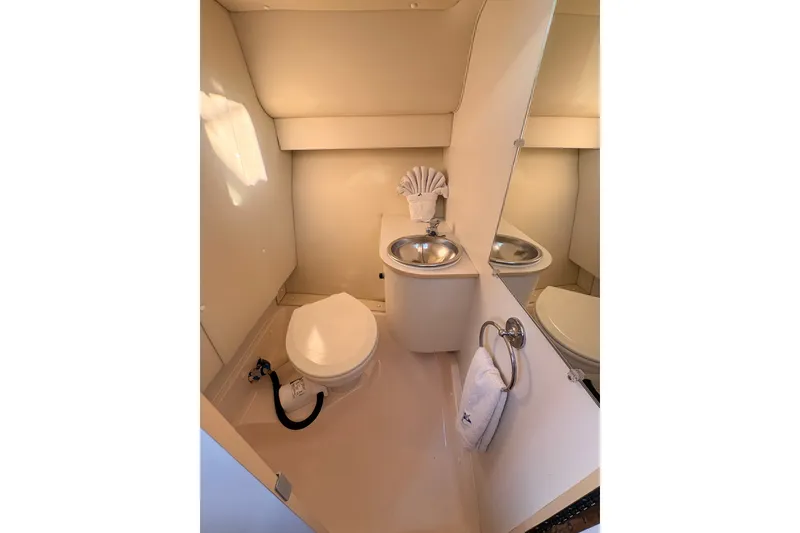 Slide: The Image of Compact bathroom in 2003 Tiara Yachts 2900 Coronet with toilet and sink. - 47