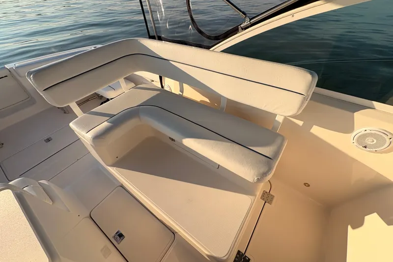 Slide: The Image of 2003 Tiara Yachts 2900 Coronet interior seating with white upholstery and sleek design. - 44