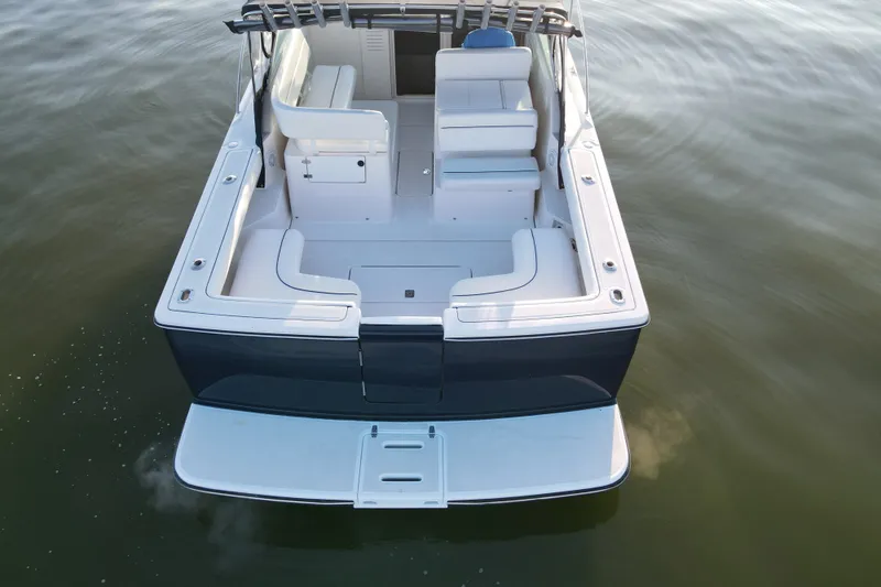 Slide: The Image of 2003 Tiara Yachts 2900 Coronet boat, rear view, on calm water. - 20