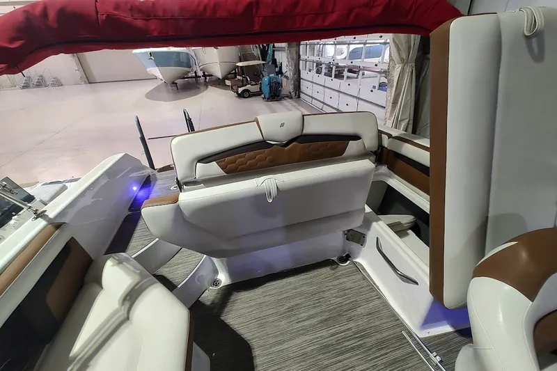 Slide: The Image of Interior of 2020 Four Winns HD220 boat with stylish seating and modern design. - 23