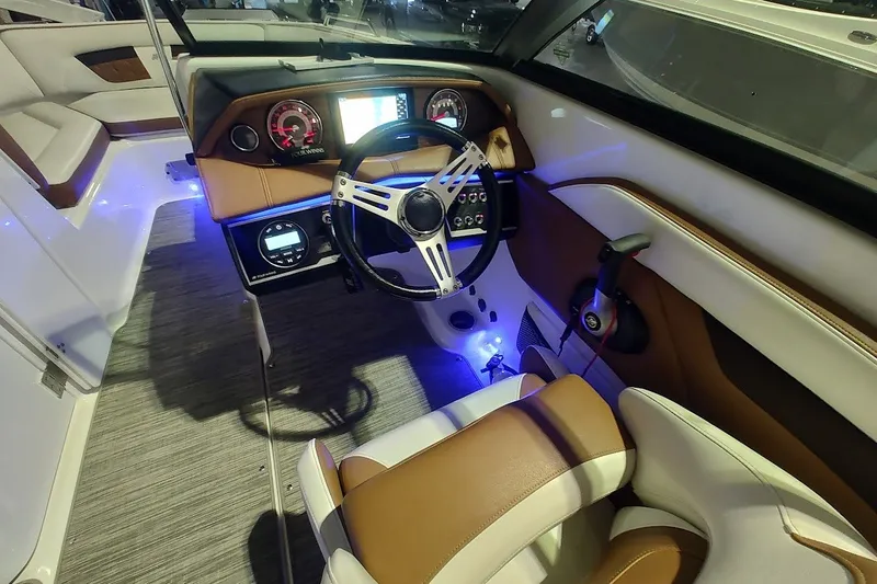 Slide: The Image of 2020 Four Winns HD220 boat interior with modern dashboard and steering wheel. - 18