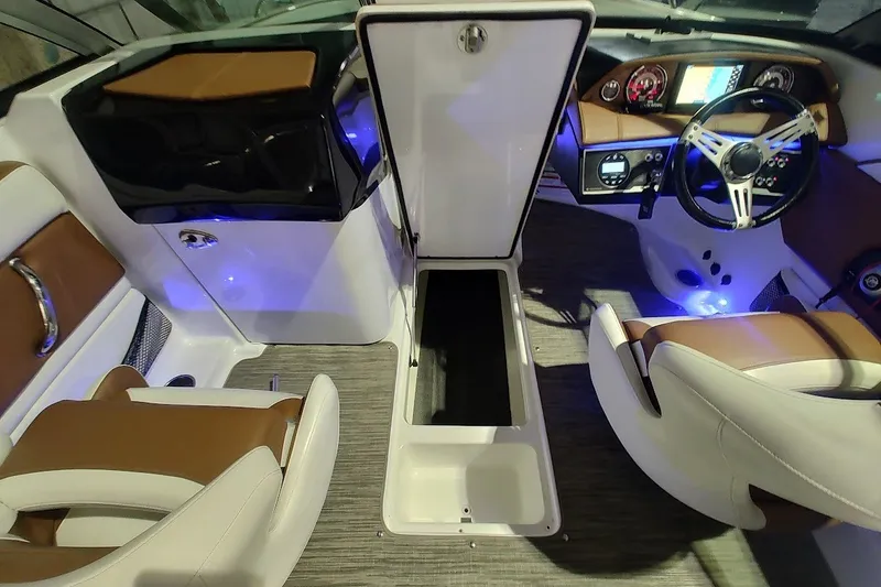Slide: The Image of Interior of 2020 Four Winns HD220 boat with modern dashboard and seating. - 15