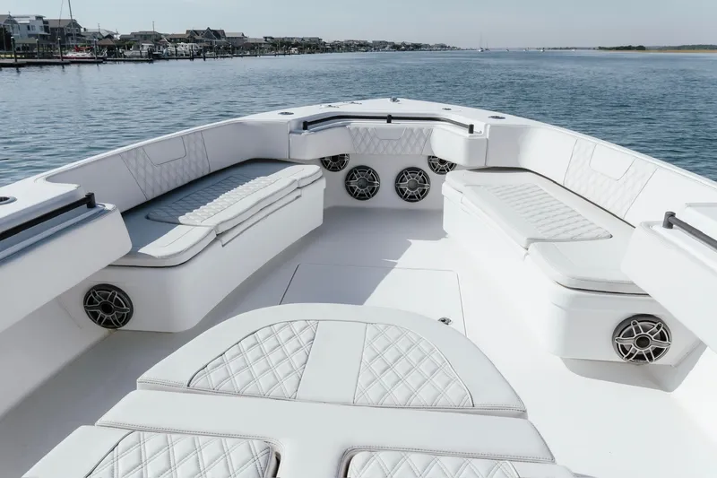 Slide: The Image of 2023 Contender 44 ST boat interior with luxurious seating and waterfront view. - 19