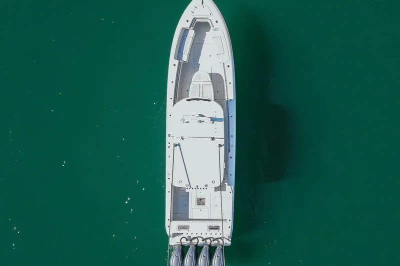 Slide: The Image of Aerial view of 2023 Contender 44 ST boat on turquoise water. - 11