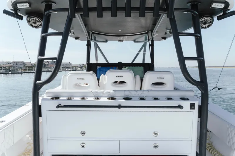 Slide: The Image of 2023 Contender 44 ST boat interior with seating and fishing rod holders. - 28