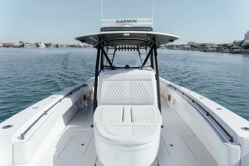 Slide: The Image of 2023 Contender 44 ST boat with Garmin equipment on calm waters. - 27