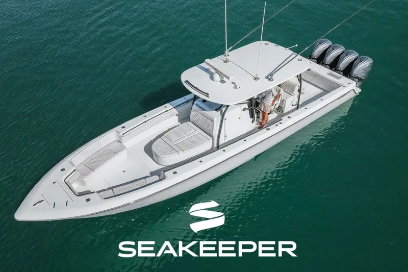 Slide: The Image of 2023 Contender 44 ST boat on water, featuring Seakeeper stabilization technology. - 1