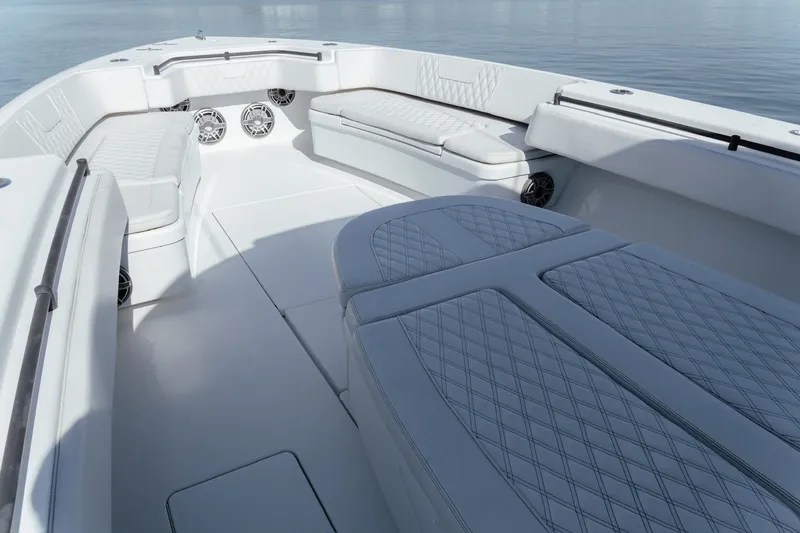 Slide: The Image of Luxurious interior of 2023 Contender 44 ST boat with cushioned seating and speakers. - 29