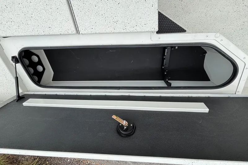 Slide: The Image of Open storage compartment in 2027 Ranger RB200 boat, showcasing interior space and design. - 16
