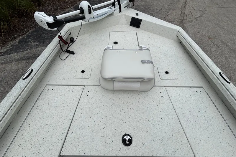 Slide: The Image of 2027 Ranger RB200 boat deck with trolling motor and cushioned seat. - 18