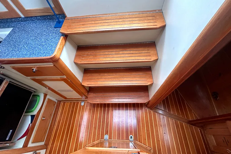 Slide: The Image of Wooden interior stairs and flooring on a 1993 Alden 43 yacht. - 20